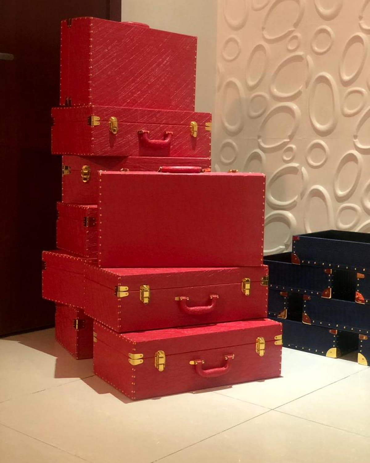 A tower of crimson keepsake trunks