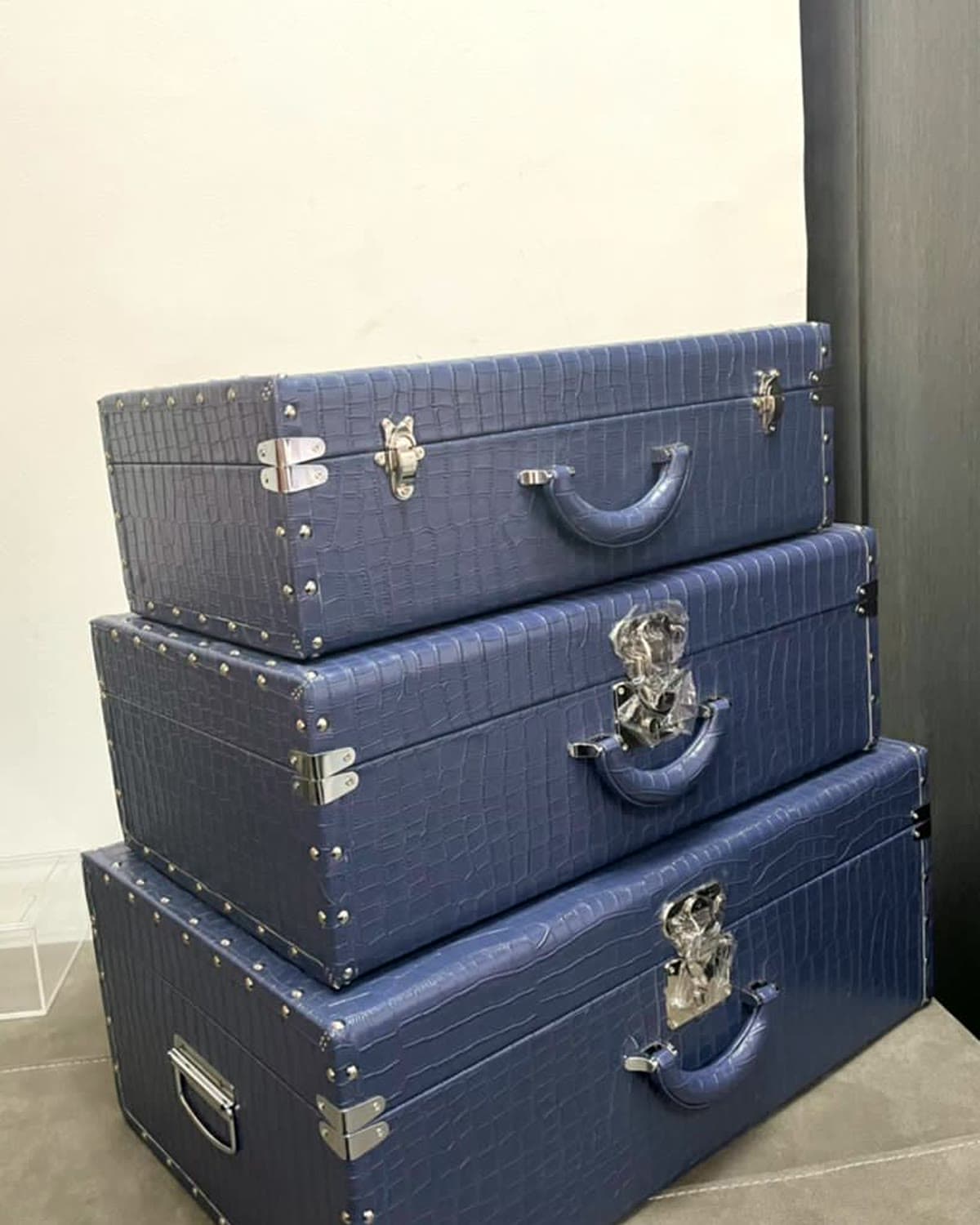 A stack of navy keepsake trunks