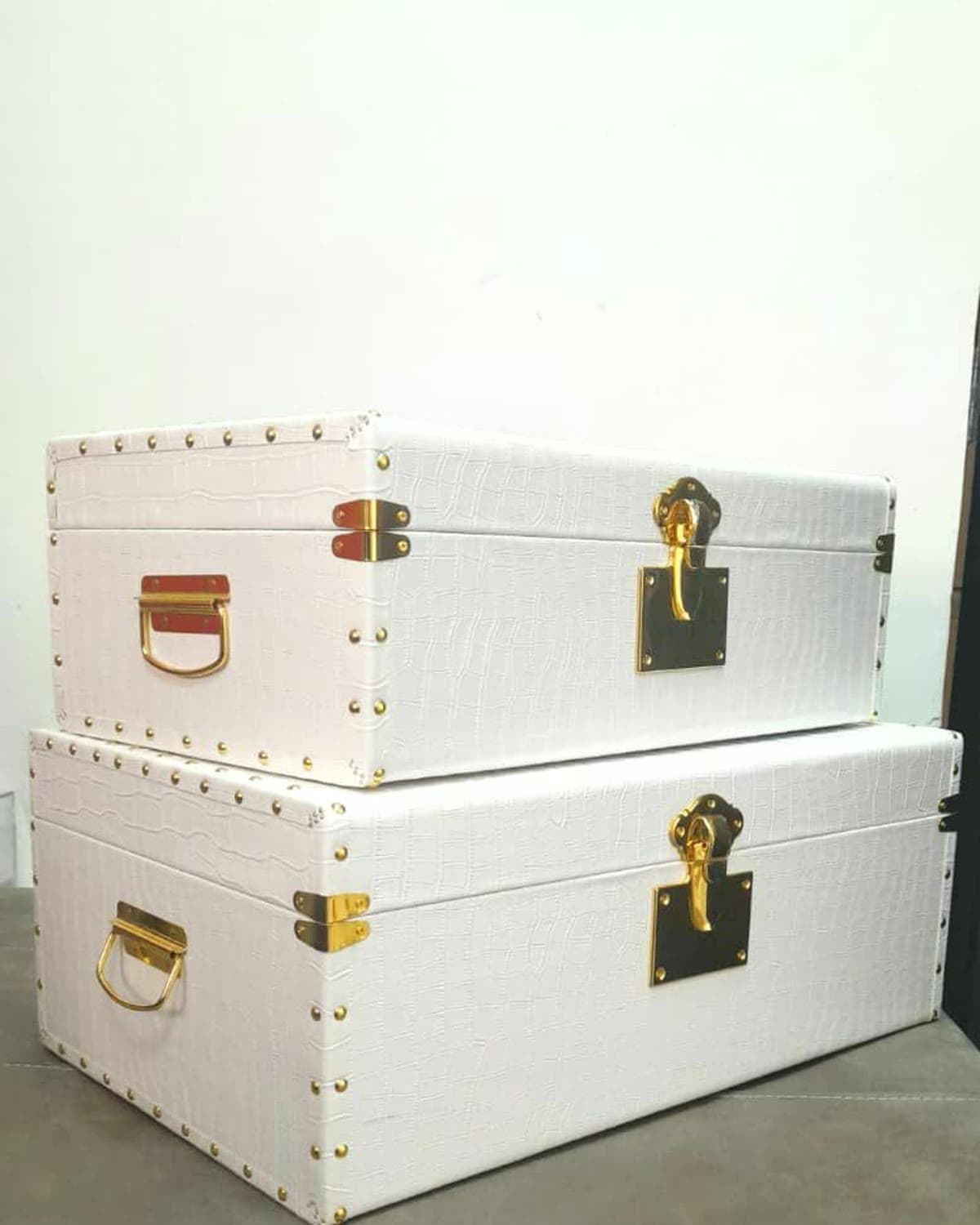 White studded keepsake trunks, stacked