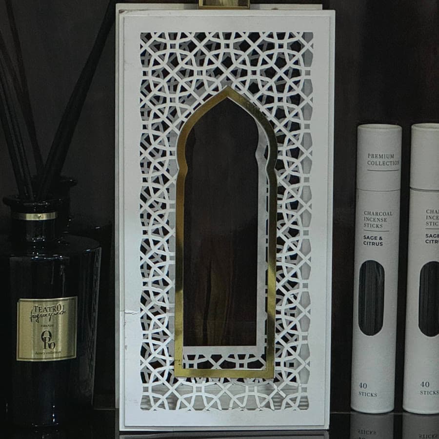 A fretwork lantern with incense