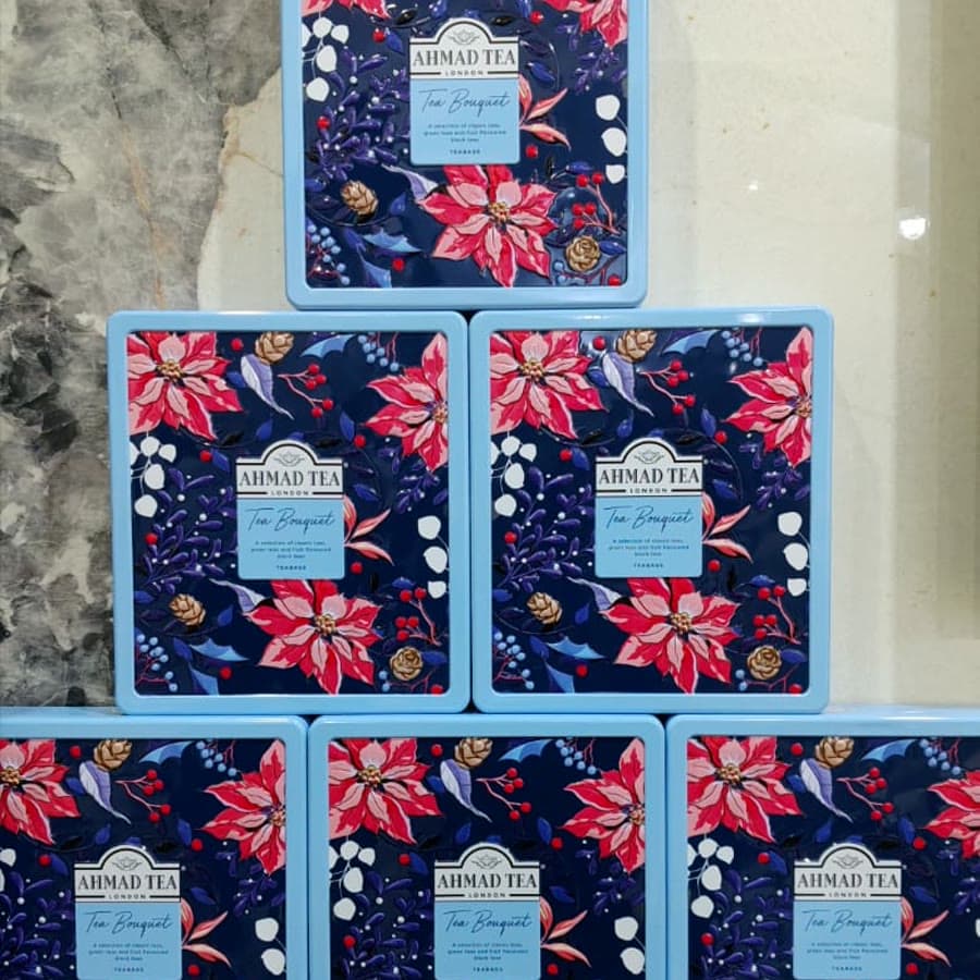 A pyramid of floral tea tins